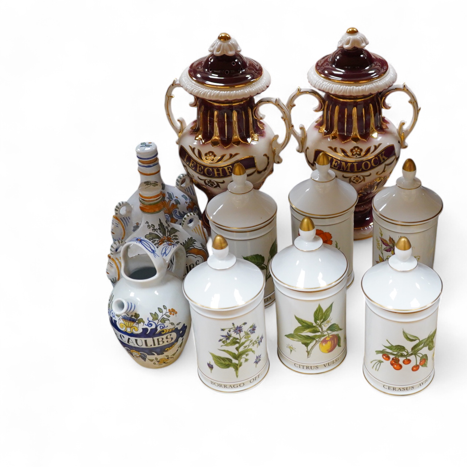 Six Italian faience Botanical apothecary jars and covers - 26cm high, two other 19th century style jars and three other related items.